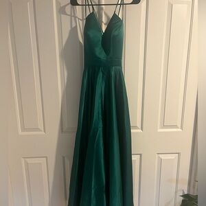 Brand new formal dress beautiful emerald green w/ strappy back & pockets size 4